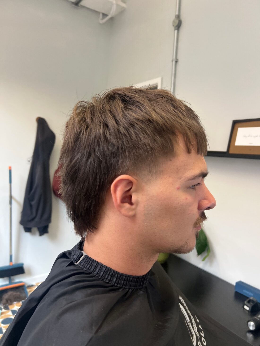 Mullet with a soft fringe and low fade
